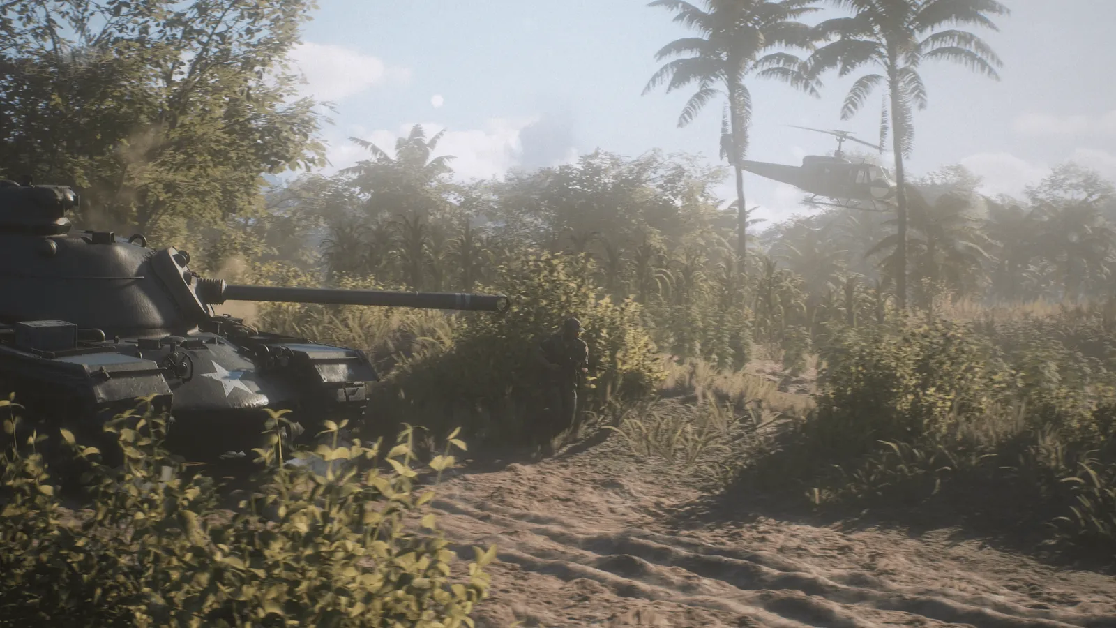 Official HLL: Vietnam media showing an armoured vehicle and helicopter moving through tropical terrain.