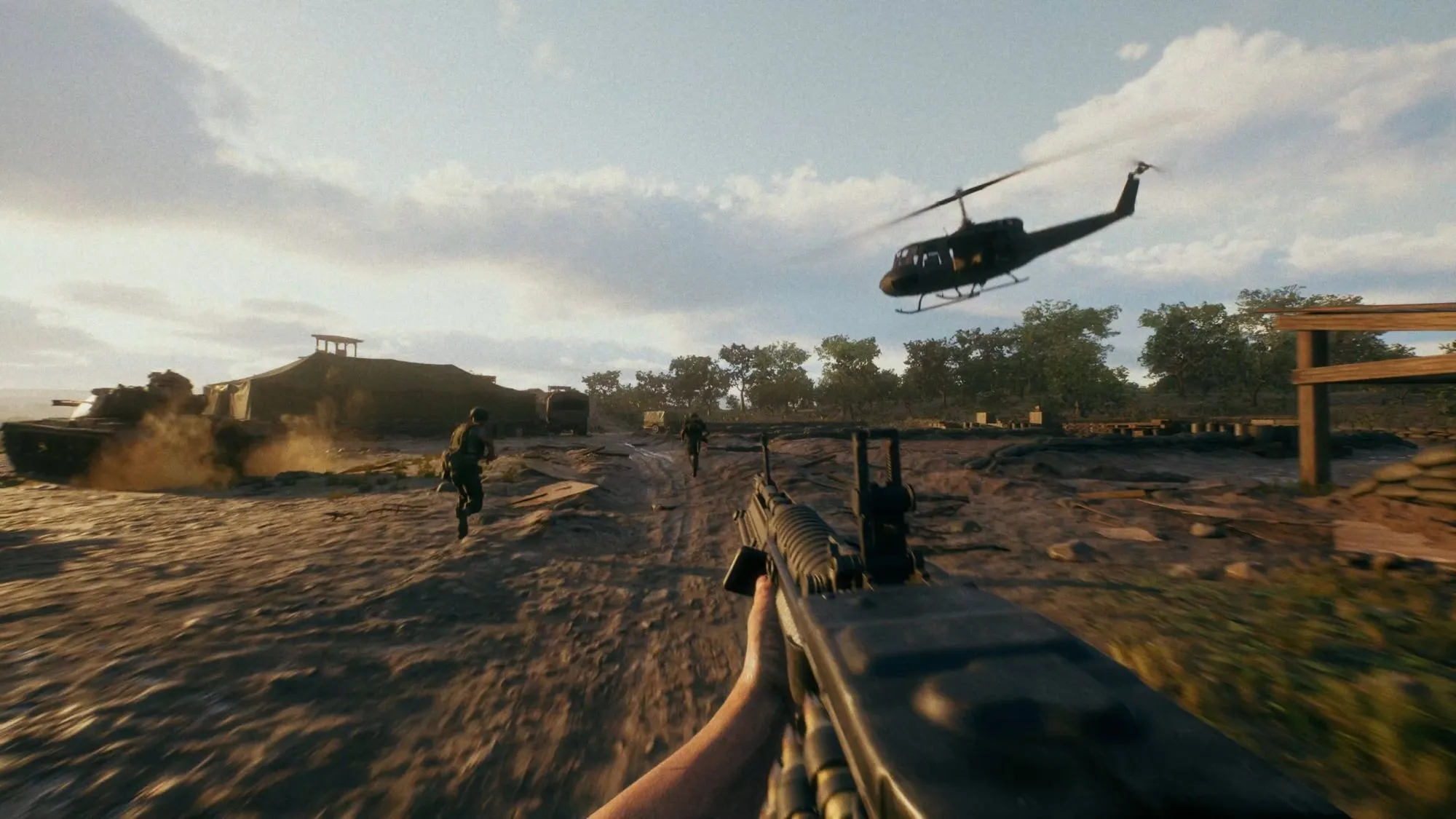 Official HLL: Vietnam media showing a helicopter over a field while soldiers and armour move below.